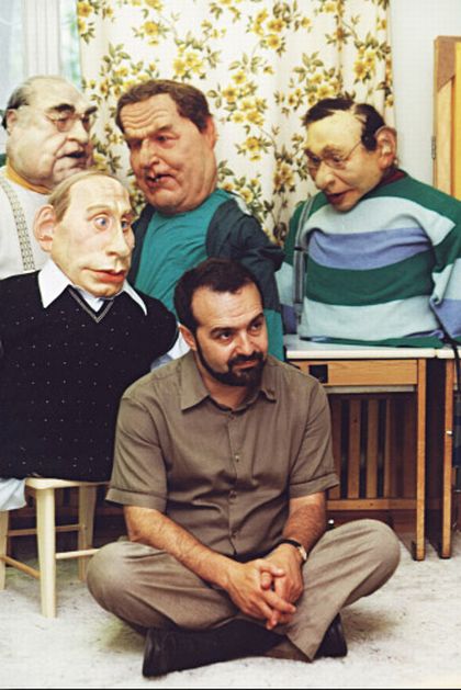Surrounded by the delightful rubber actors of the TV show "Kukly" (Puppets). Early 2000s
