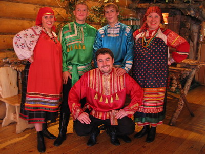 Mari people in traditional costume and interior