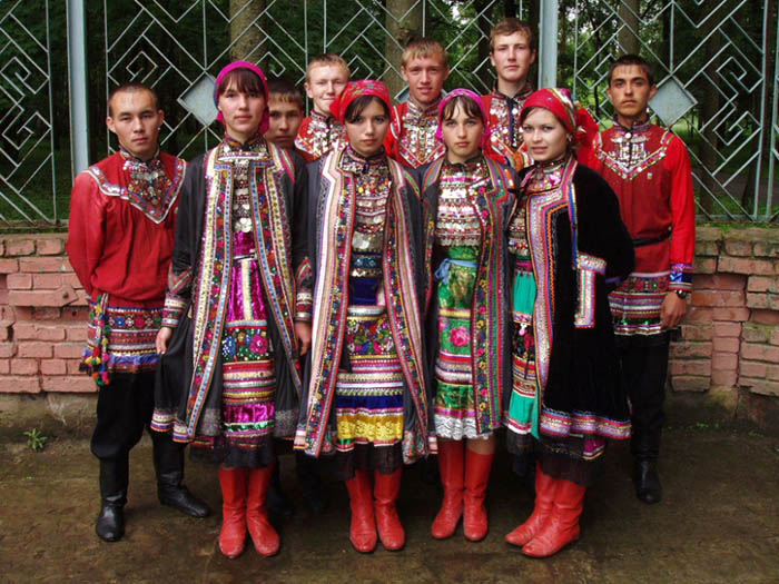 Modern young Mari people in traditional costume