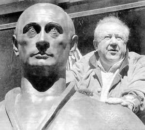 A sculpture depicting the Russian National Leader, surrounded by its delighted creator, Academician Tsereteli