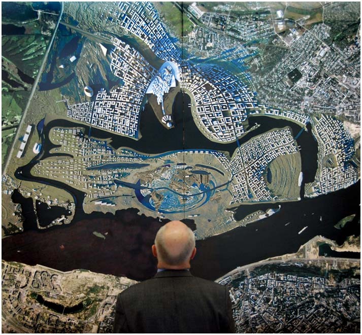 Valery Shantsev inspects the layout plan of Globe Town