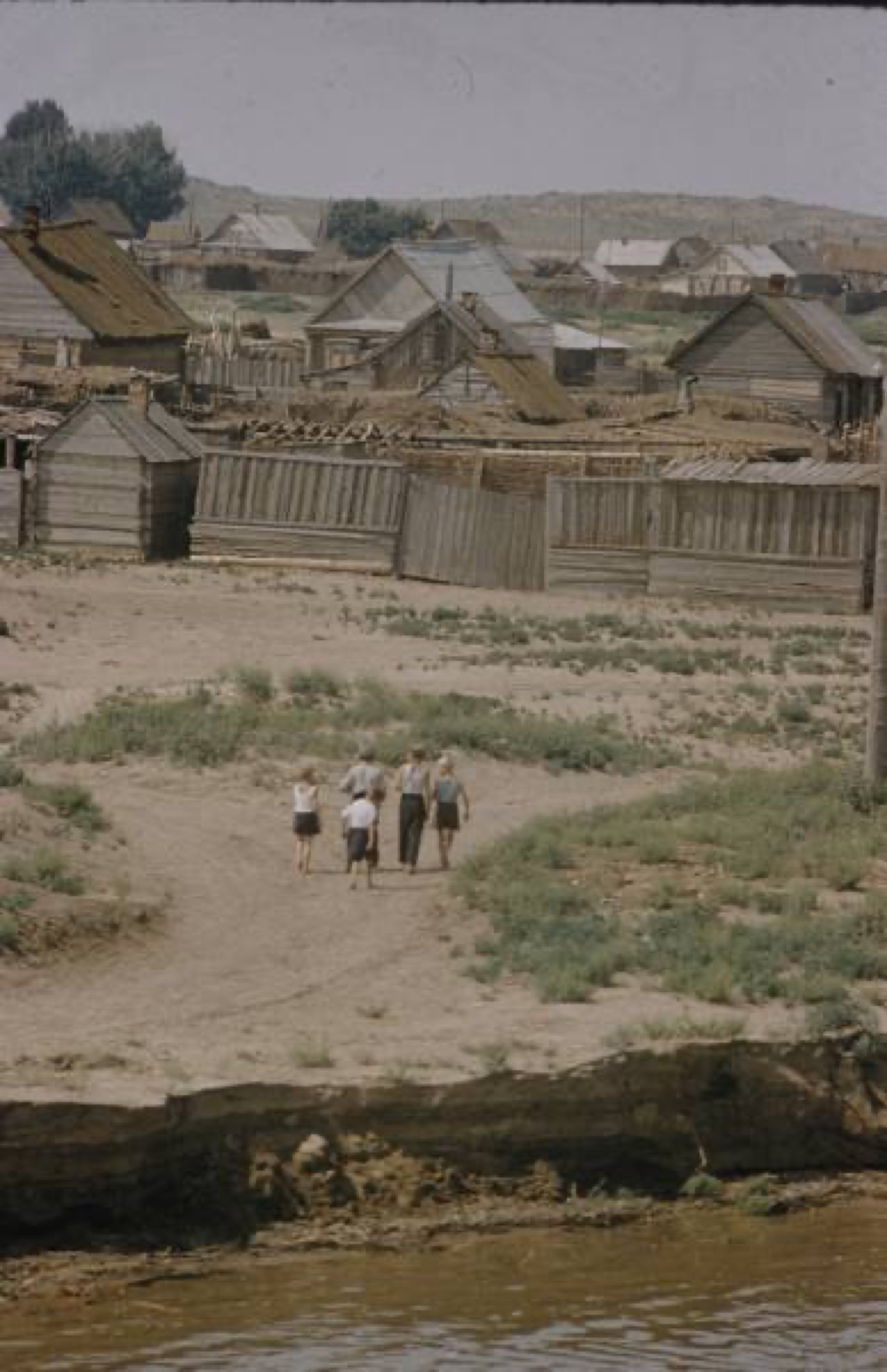 Volga riverbank, wooden village, children