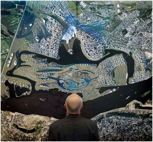 Valery Shantsev inspects the layout plan of Globe Town